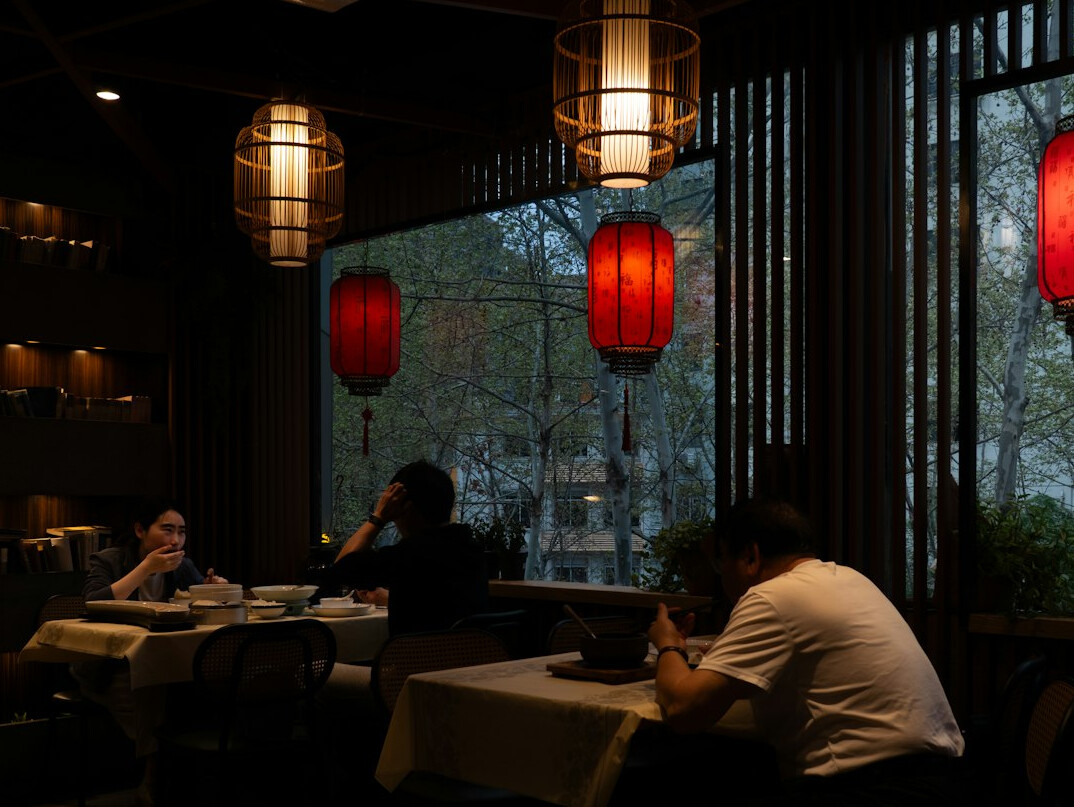 Group of Brazilian colleagues talking around a table