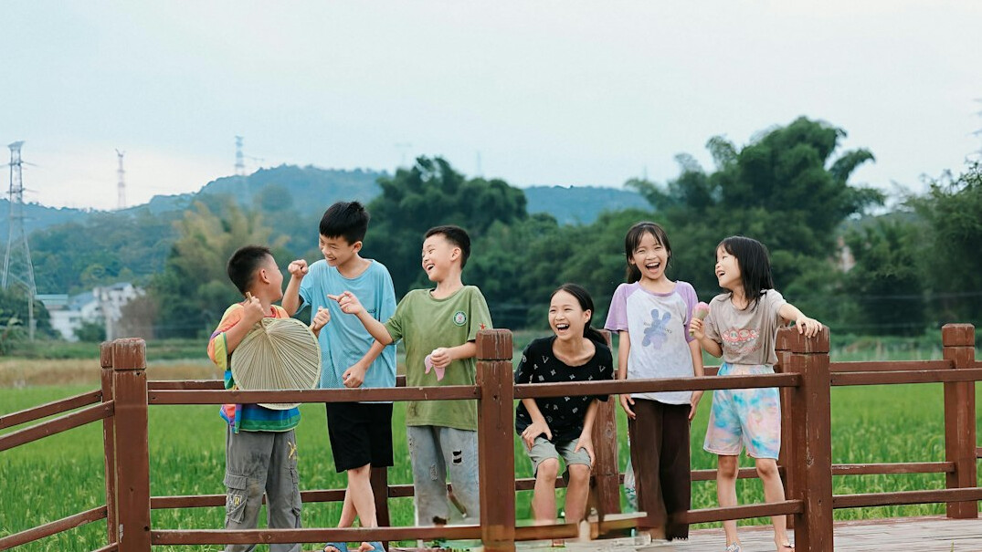 Group of friends laughing together outdoors