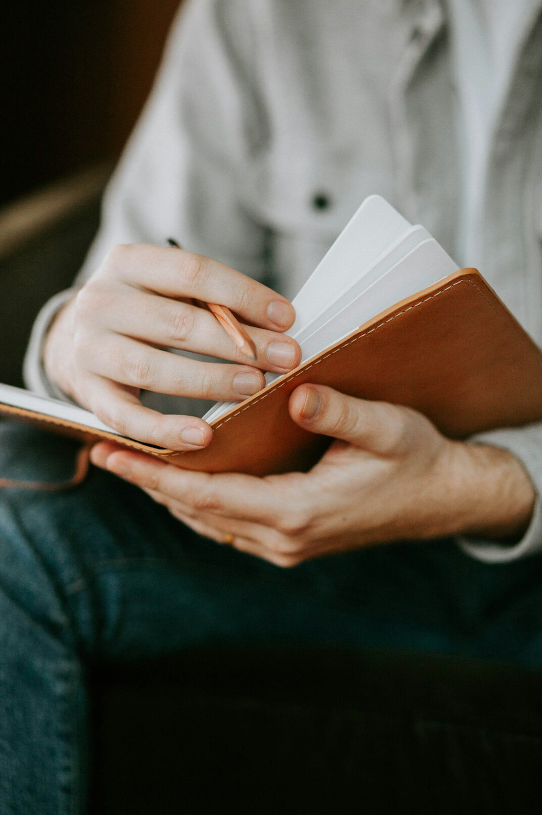 person journaling personal goals