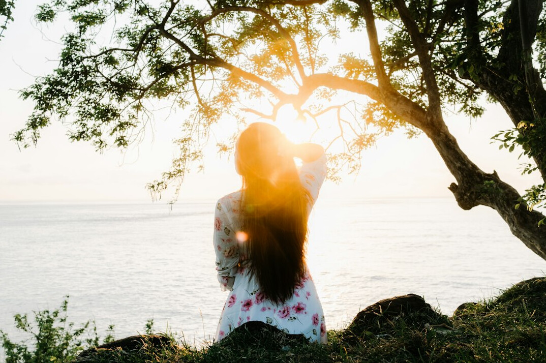 person meditating in serene nature
